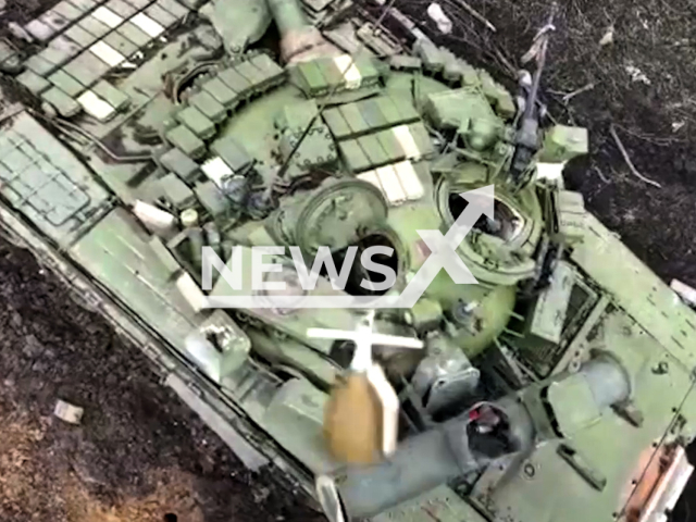 Ukrainian fighters drop bomb on a Russian tank along in Ukraine in undated footage. The footage was released by 25th Separate Airborne Sicheslav Brigade on Friday, Apr. 14, 2023.
Note: This picture is a screenshot from the video. (@dshv25opdbr/Newsflash)