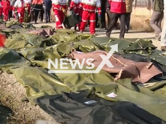 Picture shows rescuers with some of the bodies of the 176 people on board flight PS752, undated. It was  shot down by two air-defence missiles fired by the IRGC as it took off in  Tehran, Iran, in 2020, and in April, 2023 10 officelas were sentenced to jail for the crime.
 
 Note: Photo is a screenshot from a video. (Newsflash)