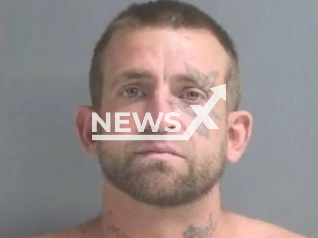 Jonathan Kiser, 33, poses in an undated photo. Kiser, along with Kaitlyn McCartney, 31, were arrested in Port Orange, Florida, on Tuesday, April 11, 2023. Note: Picture is screenshot from a video. (Port Orange Police Department/Newsflash)