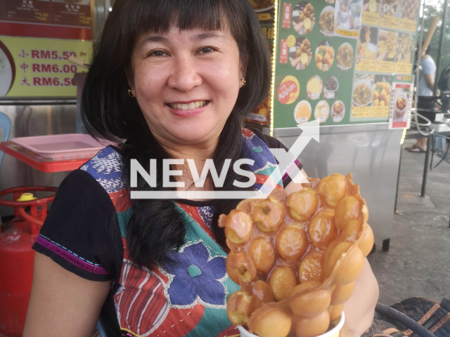 Lau Seck Yan, accused of killing her husband, poses in undated photo. She said  her body was the vessel through which her late husband Poh Seng Hiap will testify,  and  addresed the court saying 'My wife did not kill me' in Seremban, Malaysia, in April, 2023. 
 Note: Private photo.  (Lau Seck Yan/Newsflash)