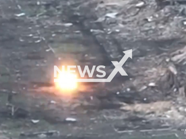 Ukrainian marines hit Russian T-80 tank in Ukraine in undated footage. The footage was released by the 35th separate marine infantry brigade on Saturday, Apr. 22, 2023. Note: Picture is screenshot from a video. (@35obrmp/Newsflash)