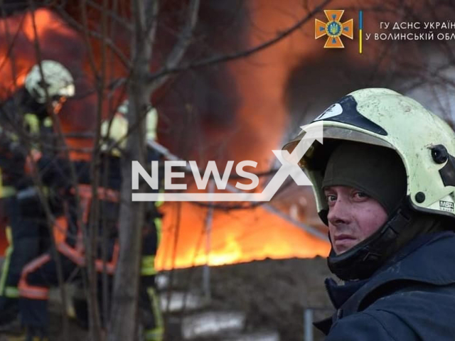 Firefighters fighting with the fire that broke out in Lutsk, Ukraine, as a result of the shelling on the territory of one of the industrial fuel storage companies in March 2022. Note: Photo from Emergency Services of Ukraine. (@MNS.GOV.UA/Newsflash)