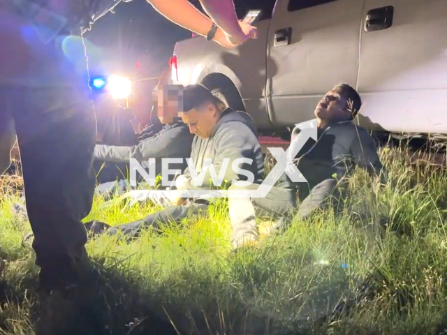 DPS Trooper takes a photo of illegal immigrants, in Kinney County, Texas, on Tuesday, April 11, 2023. A California driver was arrested for human smuggling after a traffic stop. Note: Picture is screenshot from a video. (@TxDeptPublicSafety/Newsflash)