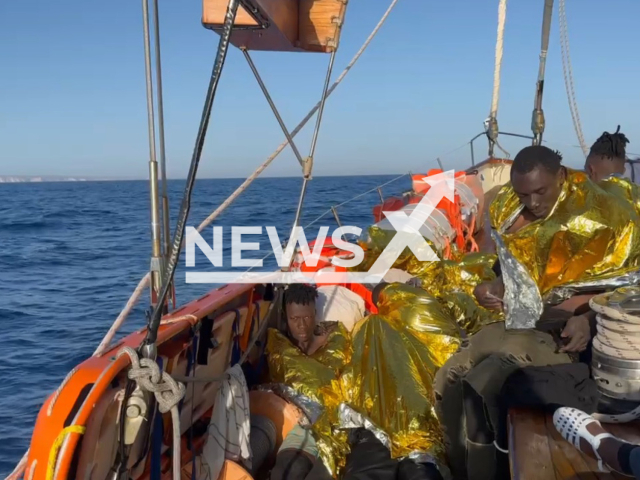 Picture shows some of the rescued 47 people, on a Open Arms boat  rescued near the island of Lampedusa, in the Mediterranean, in April 2023. The  people that sailed from Tunisia, including a pregnant woman in serious condition and a baby and a child were adrift in international waters. Note: Picture is a screenshot from a video (Open Arms/Newsflash)