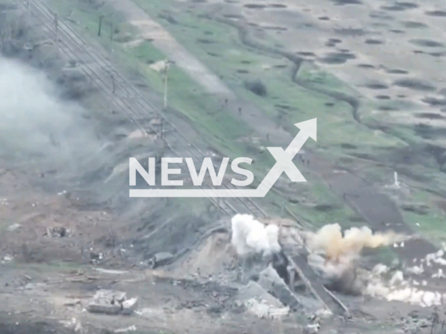 Russian soldiers run in panic after their positions were hit by the Ukrainian tanks on the frontlines in Ukraine in undated footage. The footage was released by 36th separate marine brigade on Wednesday, Apr. 26, 2023. Note: Picture is a screenshot from a video (@36obmp/Newsflash)