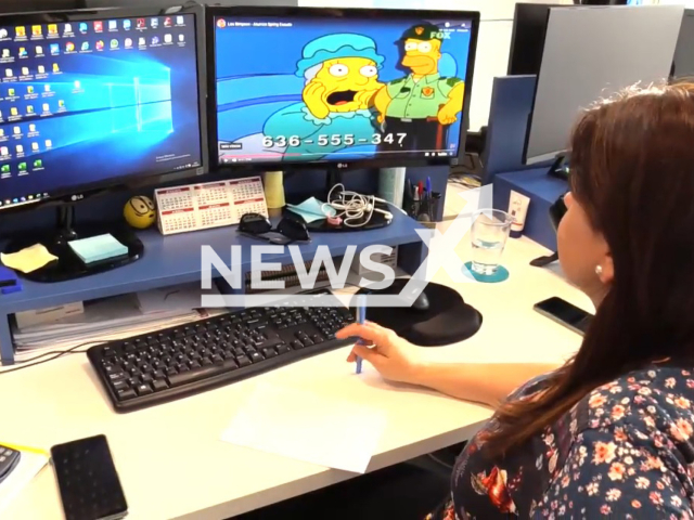 Image shows an employee of the InnaTic company in the city of Murcia, Spain, with the phone number shown in the background, undated photo. They receive thousands of calls and WhatsApp messages because their phone number appeared in an episode of 'The Simpsons'. Note: Photo is a screenshot from a video. (Newsflash)