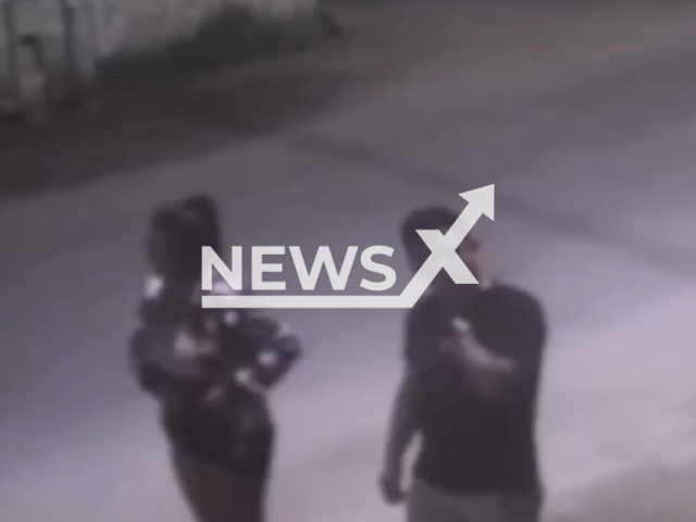 A  Venezuelan teen, 17,  walking with  Romer Campos Meza in Huaral, Peru. She lead him down an ally and covered his  eyes with her jacket   where a hit men shoot and killed him. Note: Picture is a screenshot from a video (Newsflash)