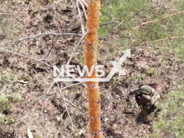 Russian solider fire with machine gun at the Ukrainian stronghold in Ukraine in undated footage. The footage was released by Russian MoD on Tuesday, May. 2, 2023.
 Note: Picture is a screenshot from a video (Russian Ministry of Defence/Newsflash)