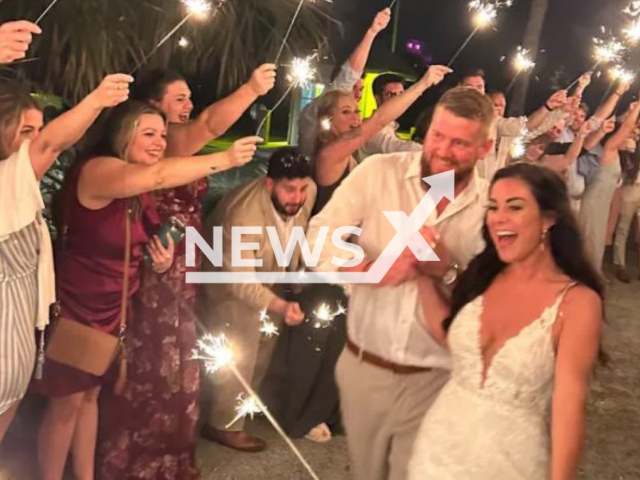 Photo shows Samantha Miller and Aric Hutchinson at their wedding reception at Folly Beach, South Carolina, USA, on Friday, April 28, 2023. The bride was killed and the groom is in critical condition after they were reportedly hit by a drunk who hit their golf cart as they were leaving their wedding reception. Note: Picture is private (GoFundMe/Newsflash)