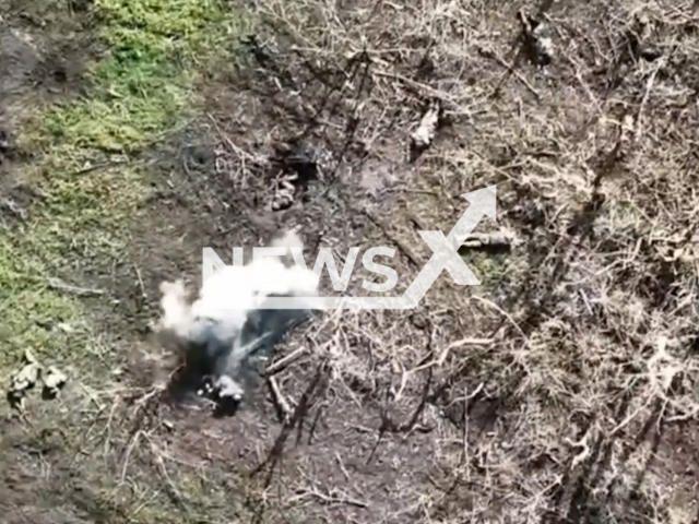 Picture shows Russian soldiers being hit by Ukrainian bombs dropped from a drone in Ukraine in undated footage. The footage was released by 36th separate marine brigade on Wednesday, May. 3, 2023.
Note: Picture is a screenshot from a video (@36obmp/Newsflash)