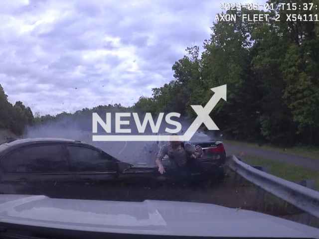 An out-of-control car collides with another car head-on, nearly missing a  police officer in Fairfax County, Virginia, USA, Monday, May 1, 2023.The car hit the vehicle and missed the officer, and the 17-year-old driver of the vehicle has been charged with reckless driving.
Note: Picture is a screenshot from a video (Fairfax County Police Department/Newsflash)