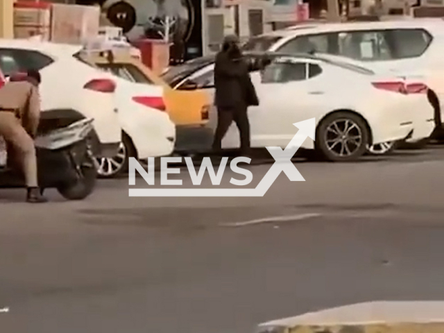 A man randomly shoots at people with a Kalashnikov, in Baghdad, Iraq, undated. The man is reportedly a drug addict. Note: Picture is a screenshot from a video (Iraqi Police/Newsflash)