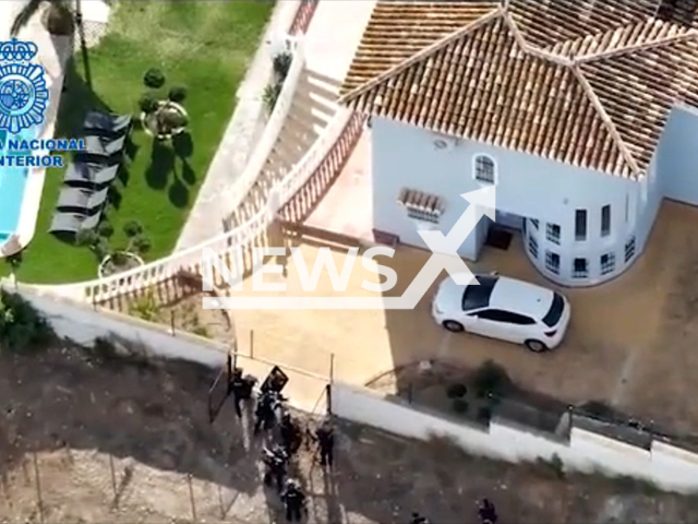 Police enter   a luxury villa in Benalmadena, Spain, undated. They rescued a cryptocurrency portfolio  manager kidnapped  and arrested the three perpetrators of the kidnapping within five hours. Note: Picture is a screenshot from a video (Newsflash)