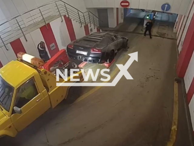 Parking lot worker attaches sport car Lamborghini Murcielago to a tow truck in Moscow, Russia on Thursday, May 4, 2023. Unnamed man, 28, showed a fake certificate of registration of the Lamborghini Murcielago to parking lot workers and stole the car. Note: Picture is a screenshot from a video (@mospolice/Newsflash)