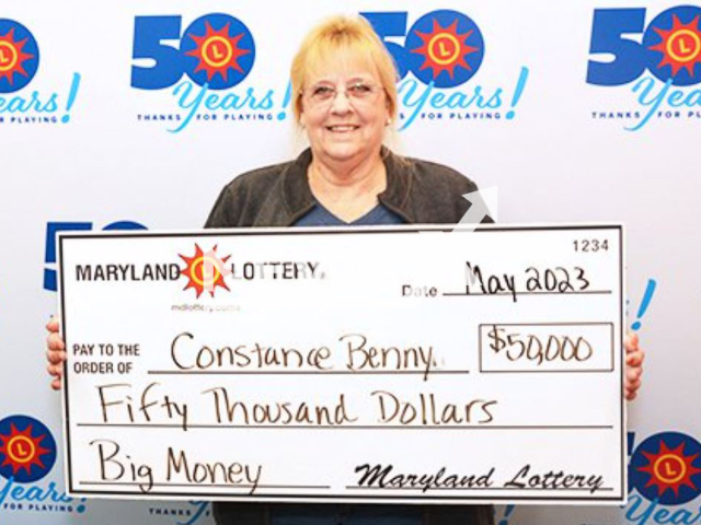 Constance Benny  poses with her winning check, undated. After winning she  locked all of her windows and doors, and couldn’t sleep after winning.
 
Note: Licensed photo.  (Maryland Lottery/Newsflash )