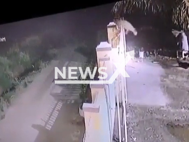 A leopard jumps over a six feet tall boundary wall of a property in Pune, India, to attack a pet dog, undated. The forest officials were asked to install barricades and cages in the area to prevent similar incidents in the future. Note: Picture is a screenshot from a video (Newsflash)