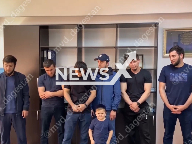 Picture shows detained TikTok star and UFC fighter Hasbulla Magomedov, 20, (front middle) and his friends in police station, Dagestan, Russia on Monday, May 8, 2023. Police detained them for traffic violation. Note: Picture is a screenshot from a video (@mvd_dagestan/Newsflash)