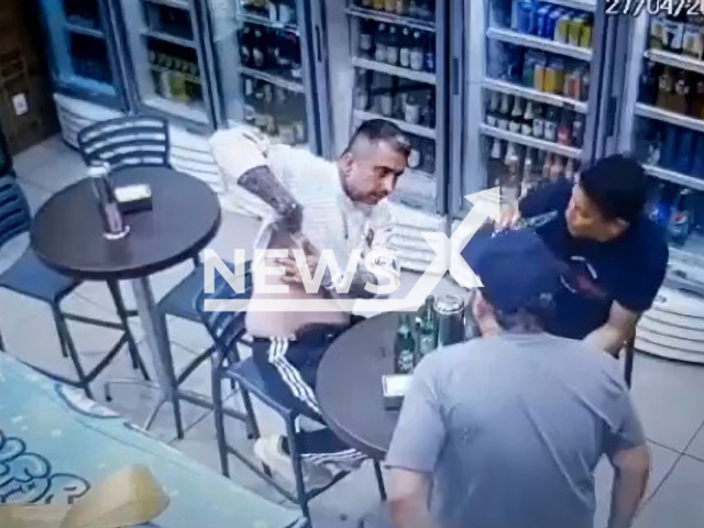 Thiago de Souza Ruiz, 36, (white shirt) shows his scar in Cuiaba, Brazil, on Thursday, April 27, 2023. Thiago de Souza Ruiz, 36,  died after he was shot by Mario Wilson Vieira, who  will be charged for his murder. Note: Picture is a screenshot from a video (Newsflash)