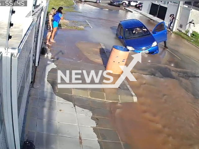 A  car  falls into a crater on a flooded street in Joao Pessoa, Brazil, on Monday, May 8, 2023. The crater was opened due to a clean water leak  and the driver  did  not suffered any injuries. Note: Picture is a screenshot from a video (Newsflash)