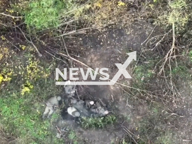 Ukrainian drones drop bombs on Russian soldiers on the frontlines in Ukraine in undated footage. The footage was released by 30th separate mechanized brigade on Wednesday, May. 10, 2023. Note: Picture is a screenshot from a video (@30brigade/Newsflash)