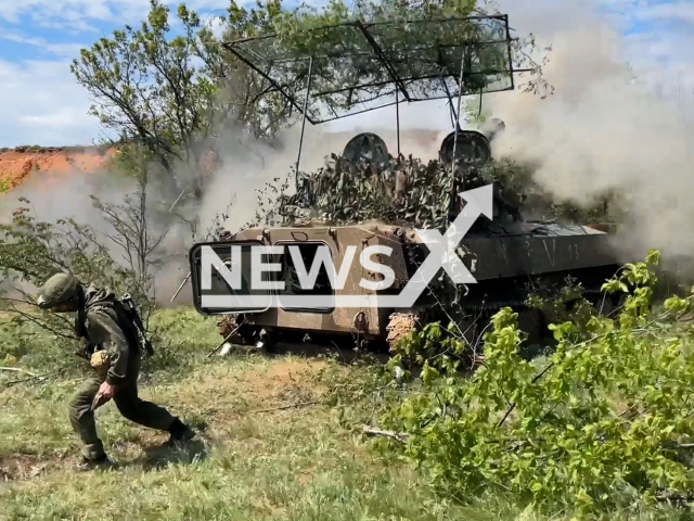 Russian artillery fire from the 122-mm howitzers "Gvozdika" at the Ukrainian military positions in Ukraine in undated footage. The footage was released by Russian MoD on Thursday, May, 11, 2023. Note: Photo is a screenshot from a video (Ministry of Defense of Russia/Newsflash)