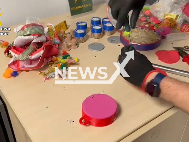 Picture shows police investigating the objects in Madrid, Spain, undated. Police dismantled an organization that trafficked pink cocaine hidden  in love-themed gifts. Note: Picture is a screenshot from a video (Newsflash)