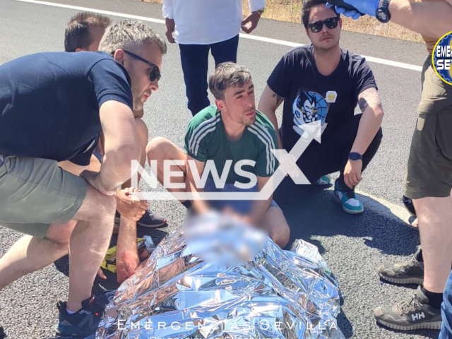 Irish firefighters attending to a  motorist after a crash, near Seville, Spain, on Sunday, May 14, 2023. The firefighters from   Dublin were in Seville participating in a conference on rescue. 
 
Note: Emeregncy services photo. (@EmergenciasSev/Newsflash)