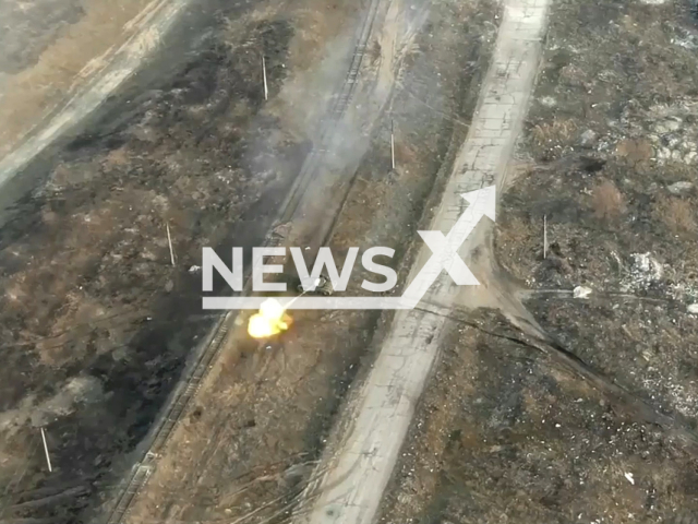 The National Guard of Ukraine shared a video that shows a Russian tank being destroyed in the Luhansk region. Note: This picture is a screenshot from the video (National Guard of Ukraine/Newsflash).