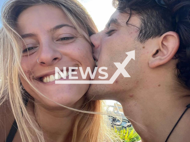 Benjamin Gamond, 23, from Cordoba, Argentine, kisses his girlfriend Carmela Martinez in undated photo. He was on vacation with his friends and died after being hit with a machete in Lagunas de Chacahua, on the Pacific coast of Mexico on Friday, May 12, 2023. Note: Private photo. (@carmelamartinezv/Newsflash)