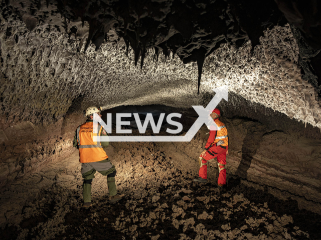 Specialists from the Volcanic Speleology Team walk inside the new volcanic tubes of La Palma, after the eruption of Cumbre Vieja in Spain, undated.  The volcanic tubes formed after the eruption of the  La Palma volcano  may be the largest in Europe.   Note: Licensed photo.  (CSIC/Newsflash)