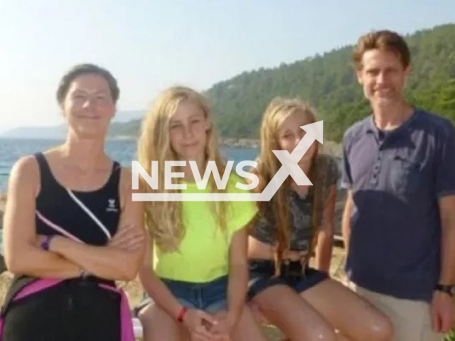 Photo shows 12-year-old twin sisters with their parents, undated. They reportedly died after falling from a sixth-story window of the building where they lived in Oviedo, Spain. Note: Picture is private (Newsflash)