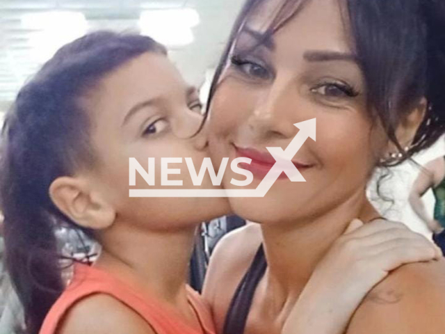 Photo shows Aline da Silva de Oliveira with her son, undated. She was allegedly murdered by her ex-husband in the middle of the street in Bangu, west of Rio, Brazil. Note: Picture is private (Newsflash)