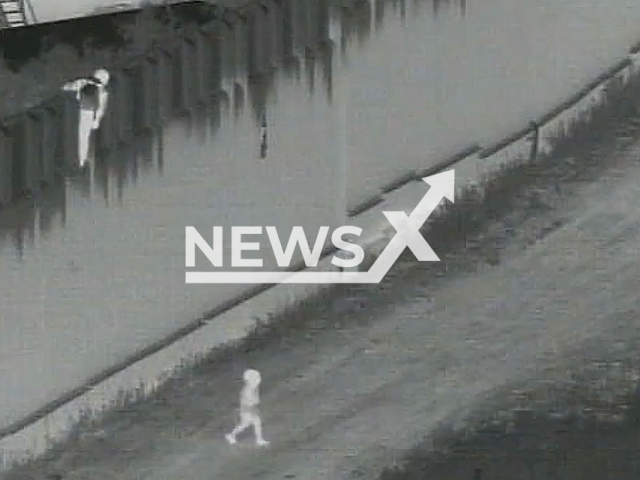 What appears to be a smuggler drops a four-year-old boy from atop a barrier at the U.S.-Mexico border in San Diego, California, USA, Monday, May 15, 2023. Chief Raul Ortiz said agents treated the child at the scene and is expected to be OK. Note: Picture is a screenshot from a video (USBP/Newsflash)