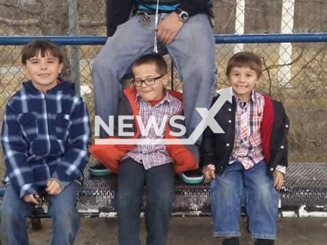 Christopher Michael Wright, 43, poses with children in undated photo. He was beaten to death in Arundel Road West in Brooklyn, Maryland. Note: Private photo. (@tryston.karopshinsky/Newsflash)