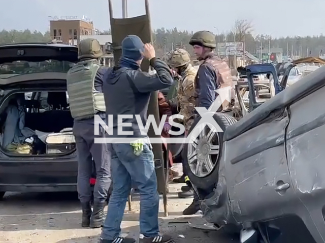 SES rescuers rescuing the residents of the city of Irpin, Kyiv region, Ukraine. Note: Picture is a screenshot from a video (SES of Ukraine/Newsflash)