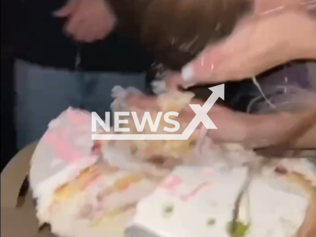 Description: Friends of birthday girl Polina Morozova, 17, put her face in a cake during birthday party in Simferopol, Crimea on Sunday, May 21, 2023. There was a sharp pin inside the cake and Polina was hospitalized with injured eye. Notes: Photo is screen from the video.(@pollyshhaa/Newsflash)